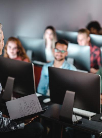 Teacher addresses students in a classroom